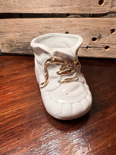 White vintage baby shoe - white,